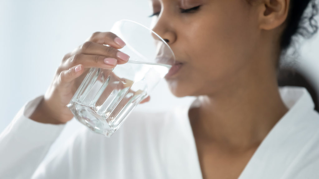 Woman drinking Ontario tap water